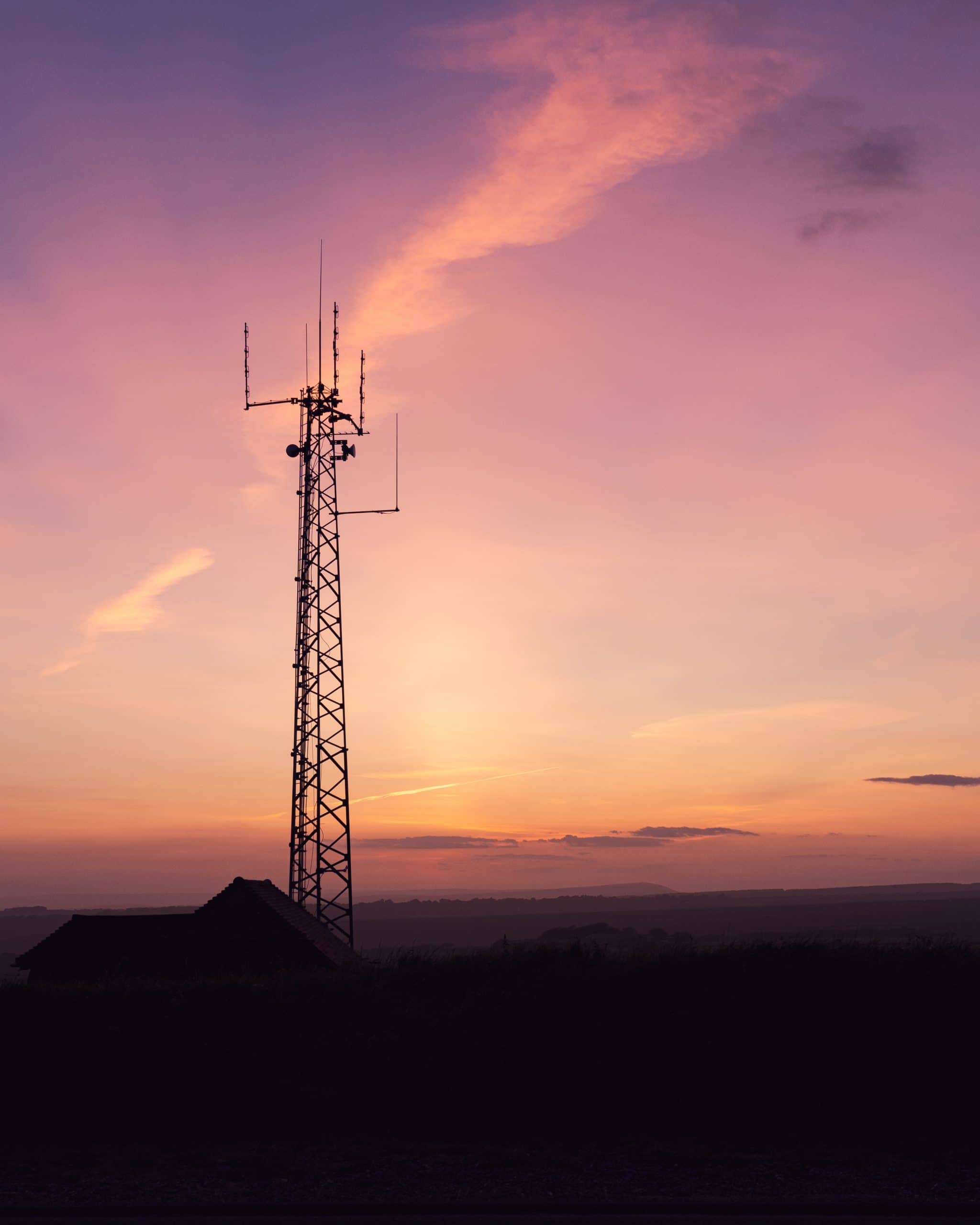 Vertical Shot Telecom Tower Field Breathtaking Sky Perfect Wallpaper Scaled