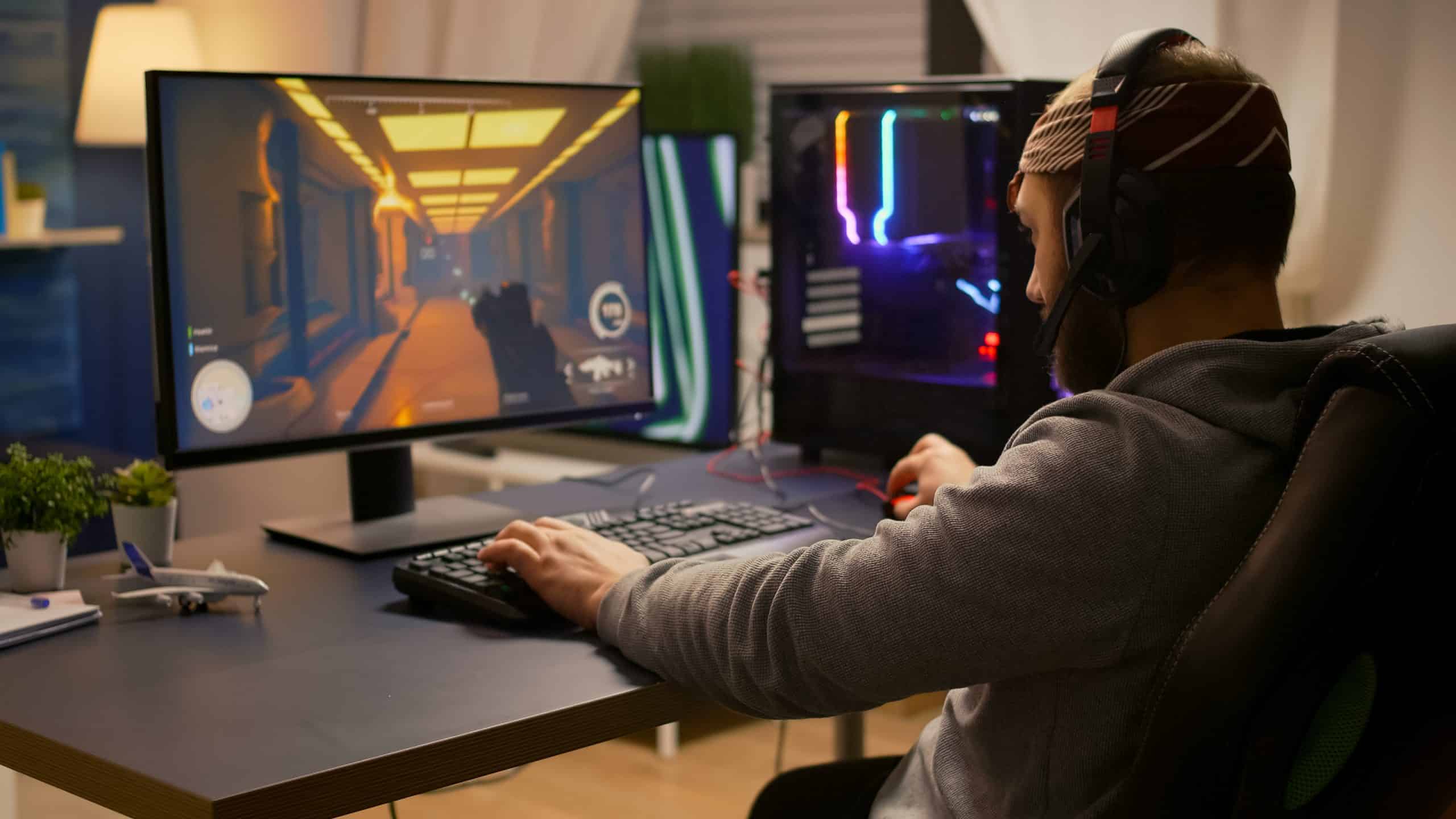 , Bismart Videogamer Winning First Person Shooter Tournament Using Rgb Keyboard And Professional Headphones Pro Player Man Talking With Other Players Online For Game Competition On Powerful Computer Scaled